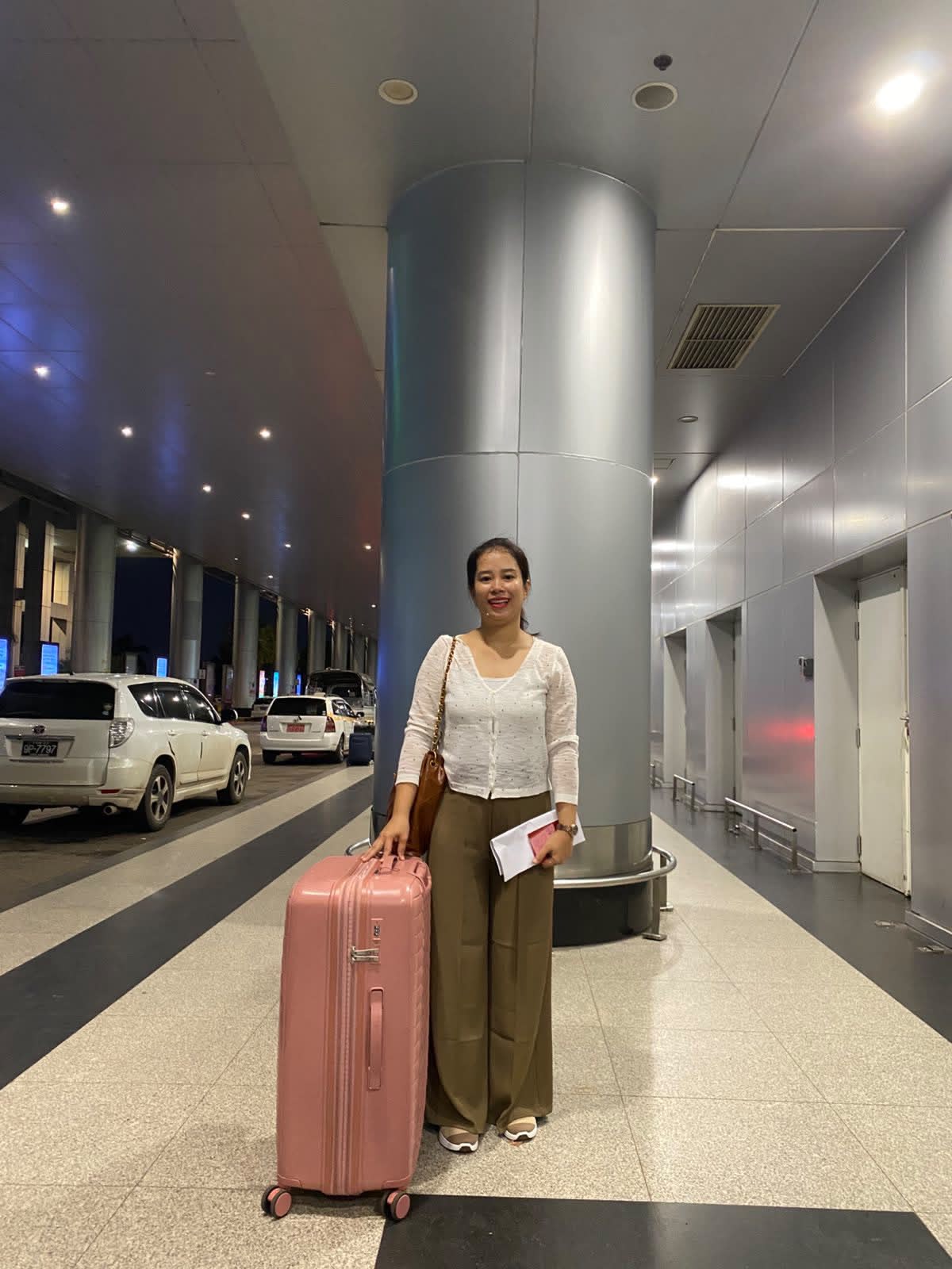 Helper arriving with luggage at the airport